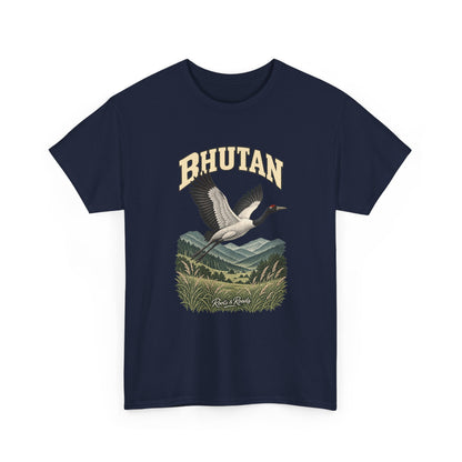 Front view of a Navy Gildan 5000 T-shirt with cream BHUTAN lettering, a flying black-necked crane above mountain hills and grasses, and Roots & Roads script.