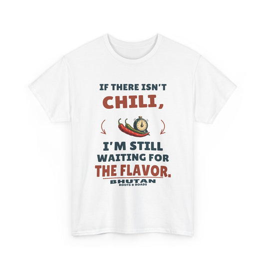 White Bhutan Still Waiting for the Flavor T-Shirt front, reading “If there isn’t chili, I’m still waiting for the flavor.” with Bhutan and Roots & Roads signature