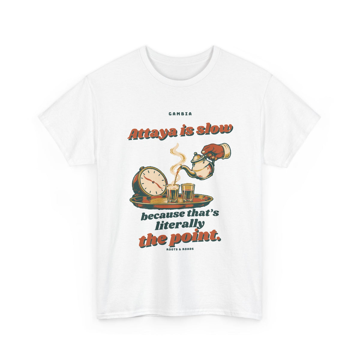 Gambia Attaya Takes Its Time T-Shirt in White — expressive retro lettering with a teapot pouring into small glasses beside a relaxed clock on the front.