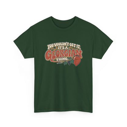 Forest Green Georgia Georgian Thing T-shirt, draped front view, with oversized retro lettering, a qvevri vessel and grapevine.
