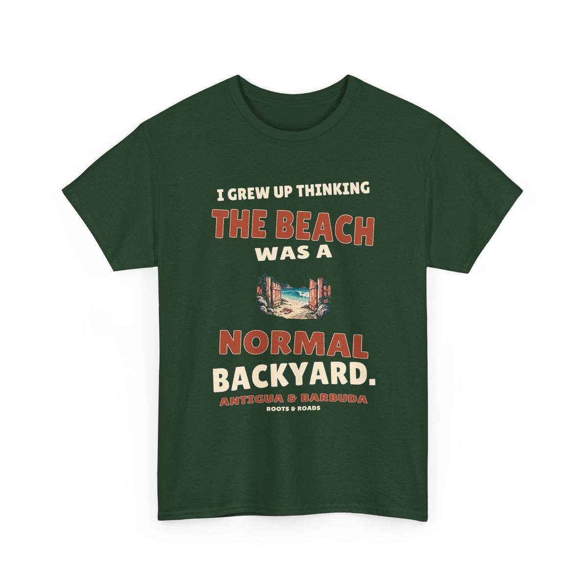 Forest Green Antigua & Barbuda T-shirt, front view with vintage artwork reading “I grew up thinking the beach was a normal backyard.” and Roots & Roads signature.