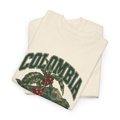 Folded Natural Colombia Fresh Prints T-shirt showing green COLOMBIA lettering above glossy coffee leaves and red cherries.