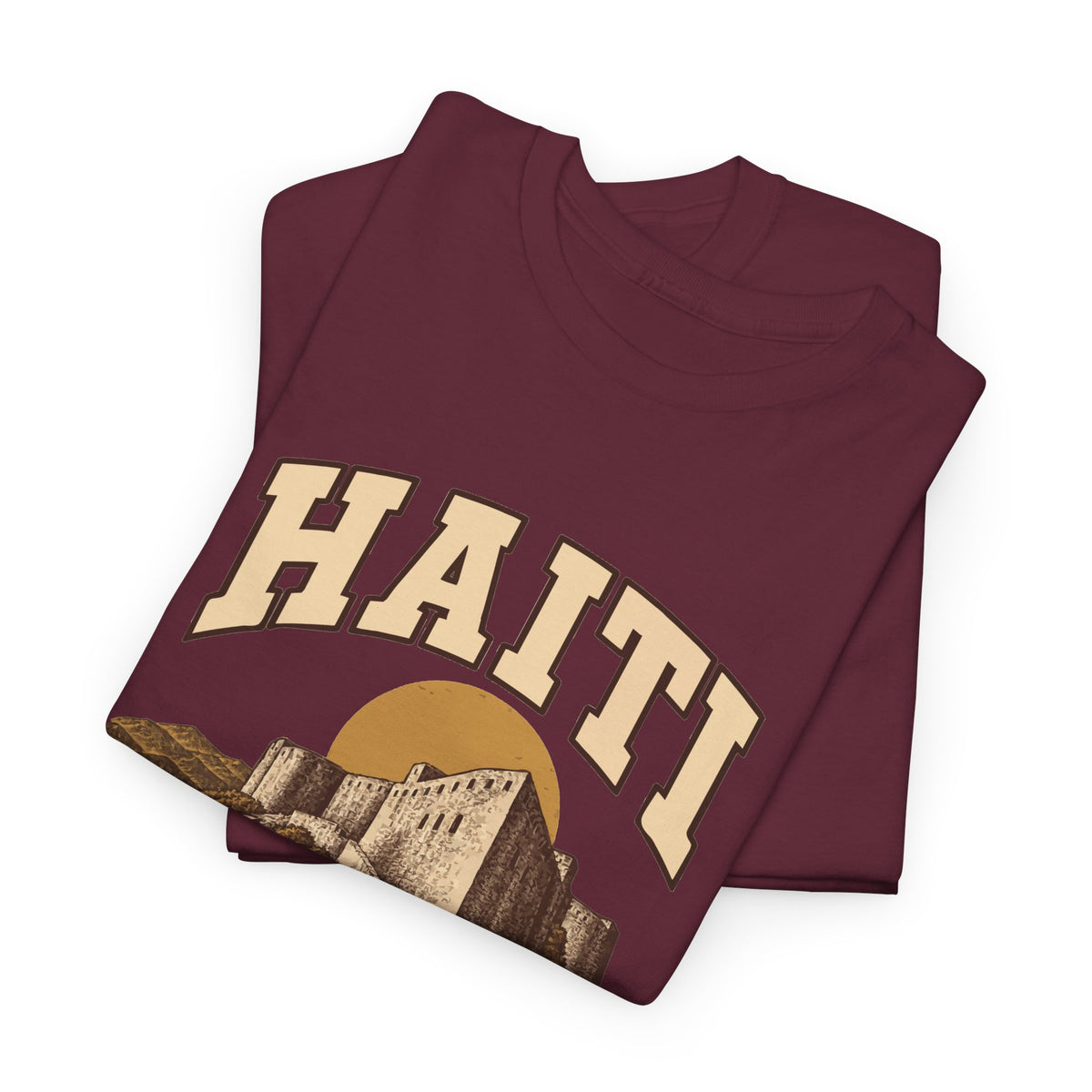 Folded Maroon Haiti Fresh Prints T-shirt showing cream country lettering and part of the illustration.
