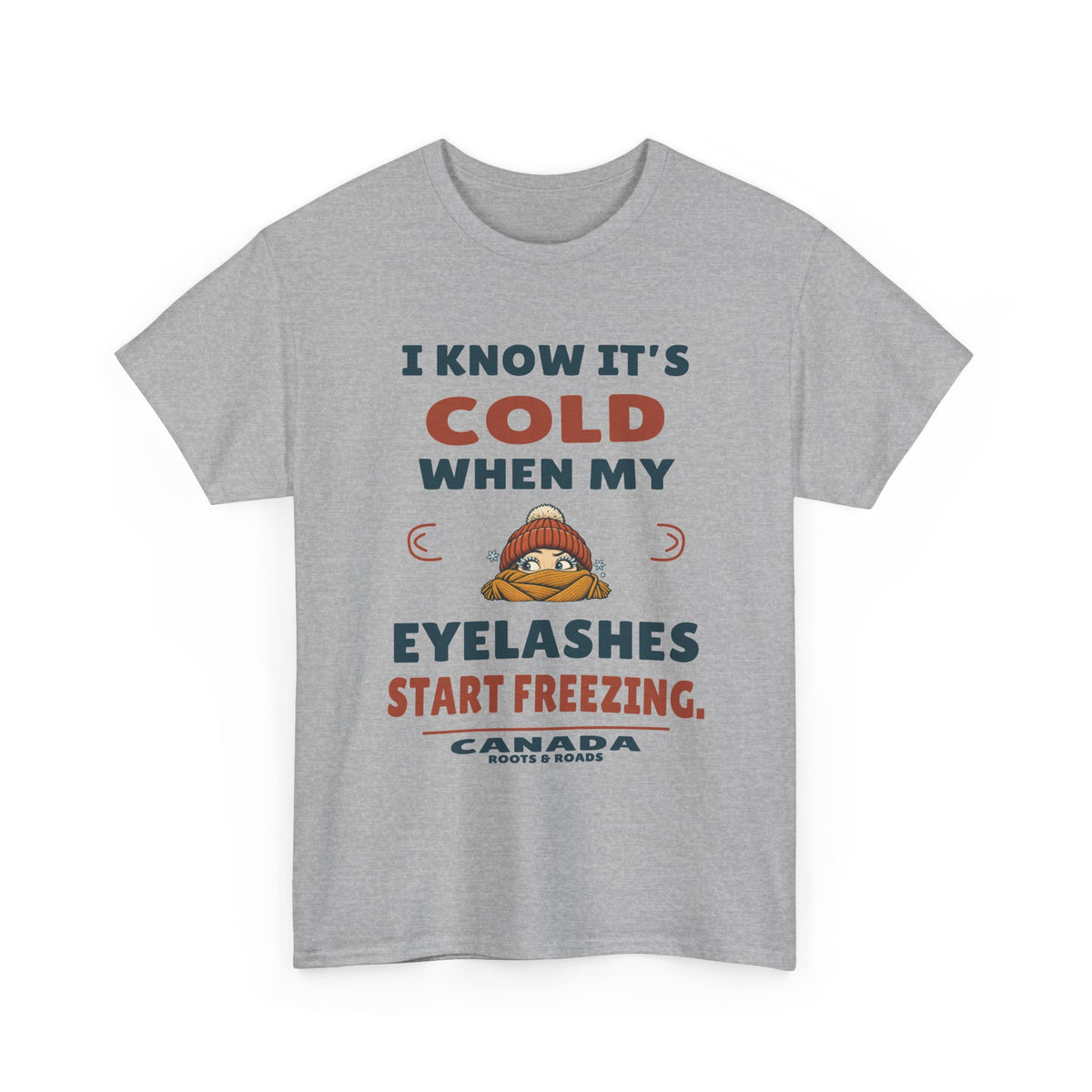 Canada Freezing Eyelashes T-Shirt in Sport Grey, front winter hat and scarf illustration with the quote “I know it’s cold when my eyelashes start freezing.”