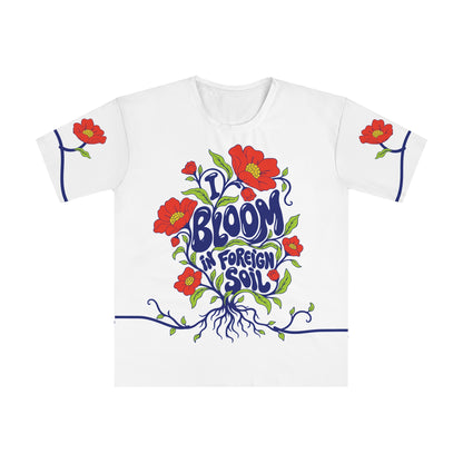 Front of the I bloom in foreign soil all-over-print T-shirt with cobalt lettering, coral flowers, roots and sleeve artwork