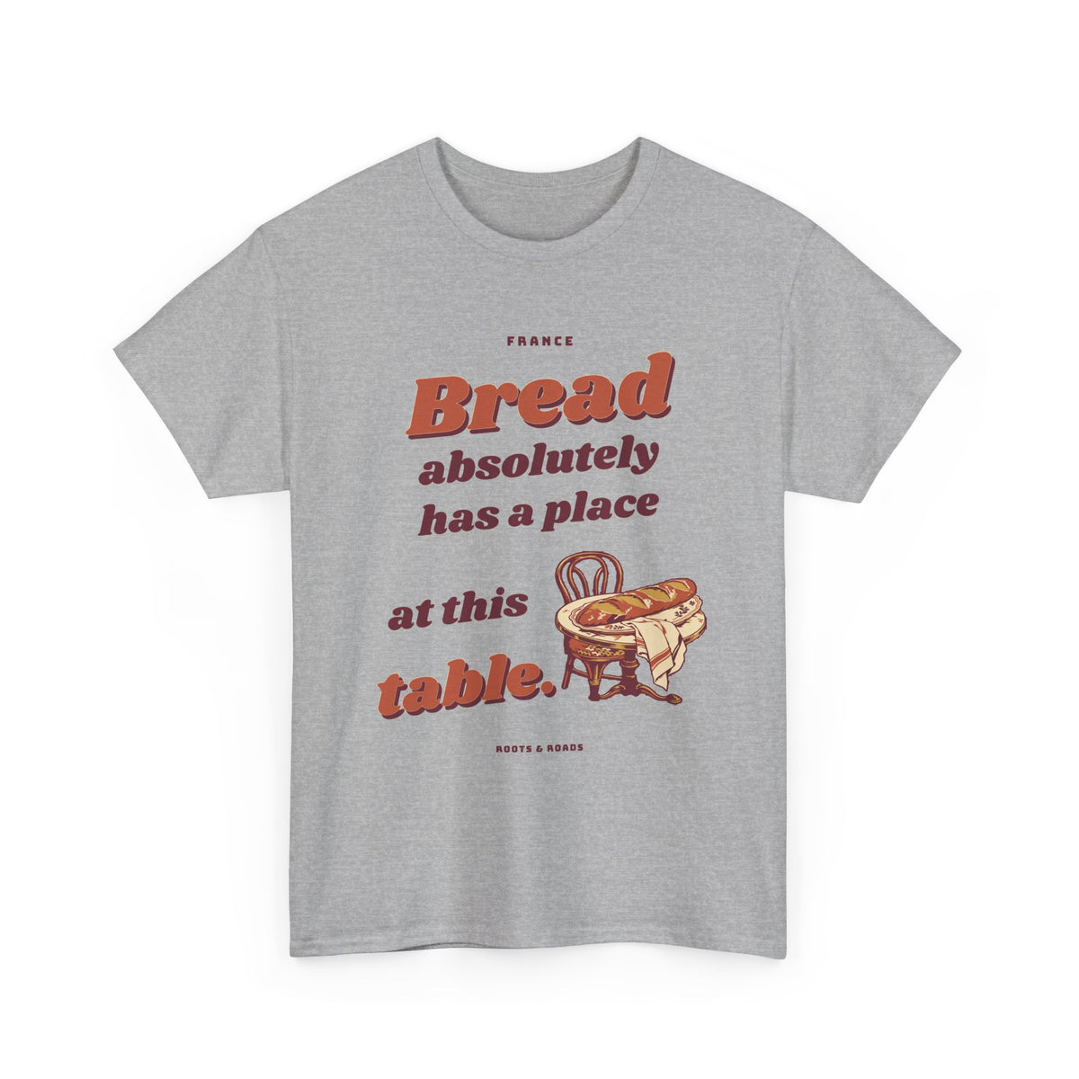 France Bread at the Table T-Shirt in Sport Grey — front retro bakery lettering with a golden baguette at a bistro table.