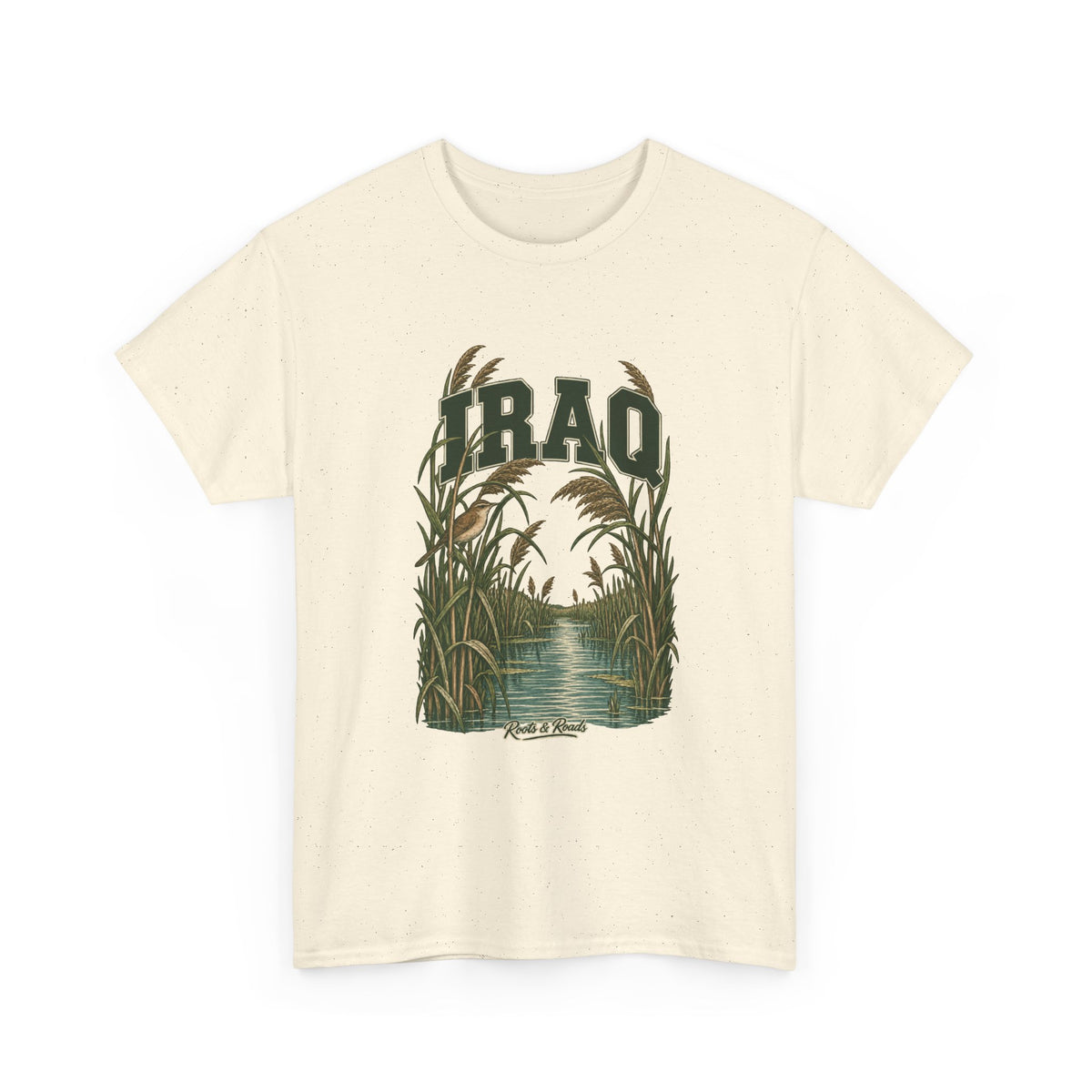 Front view of a Natural Gildan 5000 T-shirt with deep-green IRAQ lettering, a small bird, tall reeds and a quiet marsh channel, and Roots & Roads script.