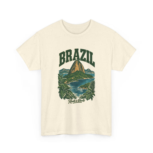 Front view of a Natural Gildan 5000 T-shirt with forest-green BRAZIL lettering, a Sugarloaf-inspired peak, blue bay water, tropical leaves and Roots & Roads script.