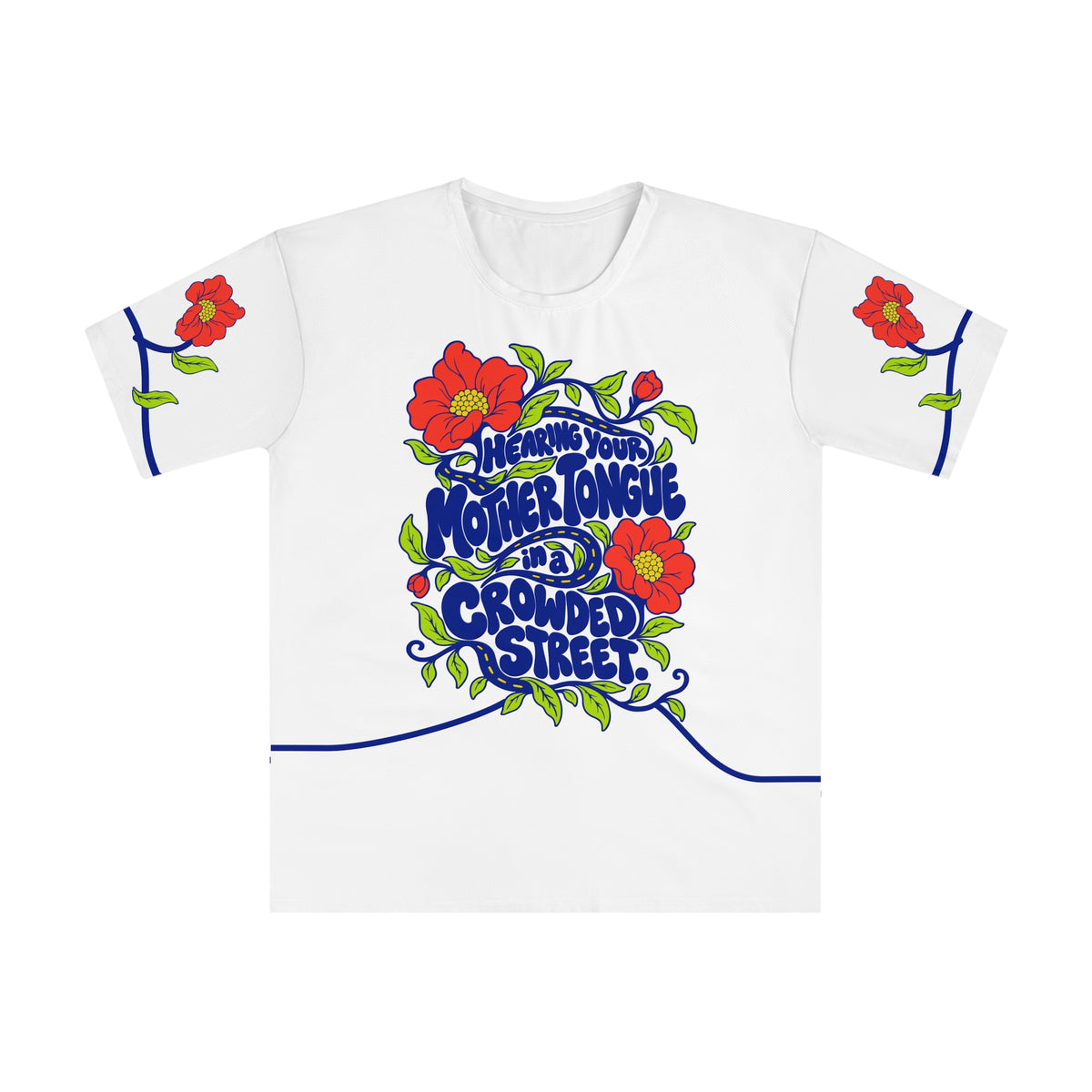 Front of the Roots & Roads “Hearing your mother tongue in a crowded street.” T-shirt with cobalt bubble lettering, a winding road, coral flowers and lime leaves on white.