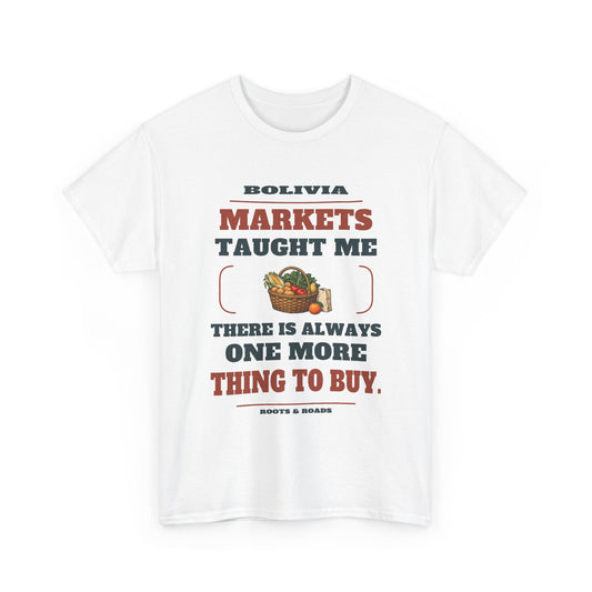 White Bolivia One More Thing to Buy T-Shirt front, reading “Markets taught me there is always one more thing to buy.” with Bolivia and Roots & Roads signature