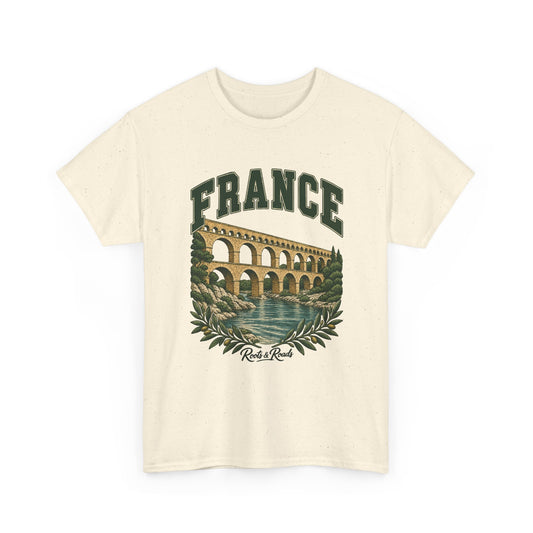 Front view of a Natural Gildan 5000 T-shirt with green FRANCE lettering above three tiers of aqueduct arches over a river with rocky banks and leafy branches, finished with Roots & Roads script.