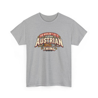 Alternate front view of the Sport Grey Austrian Thing T-shirt with “You wouldn’t get it. It’s an Austrian thing” cream athletic lettering with red offset shadows, gold scrolls and a violin with its bow.