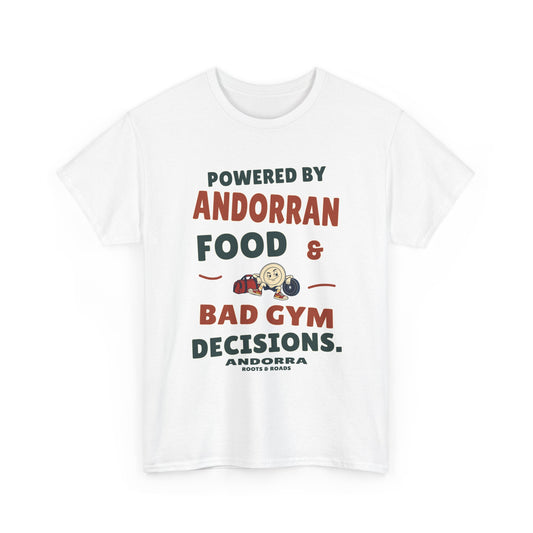 Front view of the White Andorra Bad Gym Decisions T-Shirt with rounded lettering reading “Powered by Andorran food & bad gym decisions.”, a plate character with gym bag and weight plate, Andorra label and Roots & Roads signature.