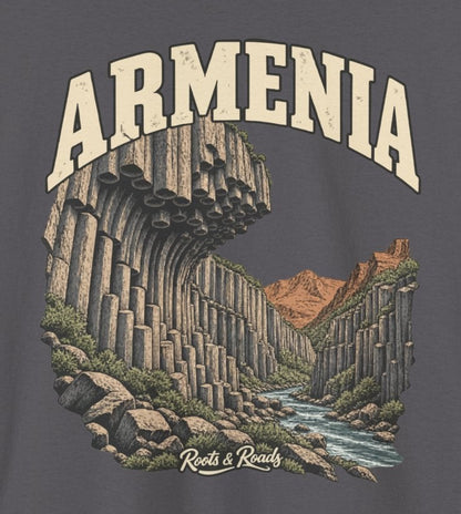 Print detail on Charcoal fabric showing ARMENIA lettering, curved basalt columns, rocky stream, warm hills and Roots & Roads signature.