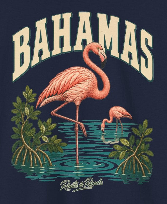 Print detail on Navy cotton showing coral-pink flamingos, mangrove leaves and turquoise water and the Roots & Roads script signature.