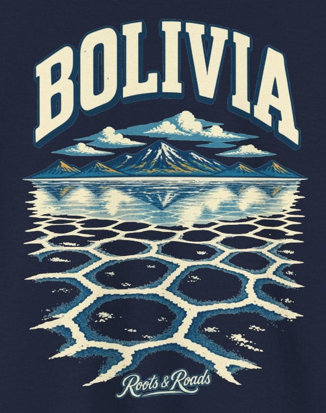 Print detail on Navy cotton showing BOLIVIA lettering, highland peaks and reflections above cream-and-blue salt-flat patterns, with Roots & Roads script.