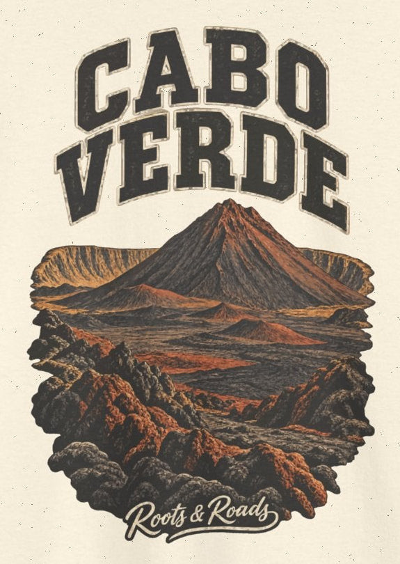 Print detail on Natural cotton showing CABO VERDE lettering, a Fogo-inspired volcanic cone and dark lava terrain, with Roots & Roads script.