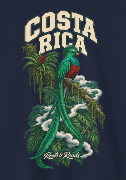 Print detail on Navy cotton showing cream COSTA RICA lettering, a green-and-red quetzal with long tail feathers, leafy branches, cloud curls and Roots & Roads script.