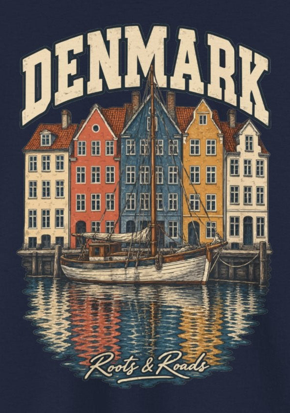 Print detail on Navy cotton showing cream DENMARK lettering, colourful harbour houses, a sailing vessel, reflections and Roots & Roads script.