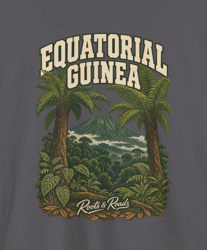 Print detail cropped from the Charcoal Equatorial Guinea supplier T-shirt mockup, showing cream two-line EQUATORIAL GUINEA lettering, tree ferns, a mountain summit and dense green forest and Roots & Roads script.