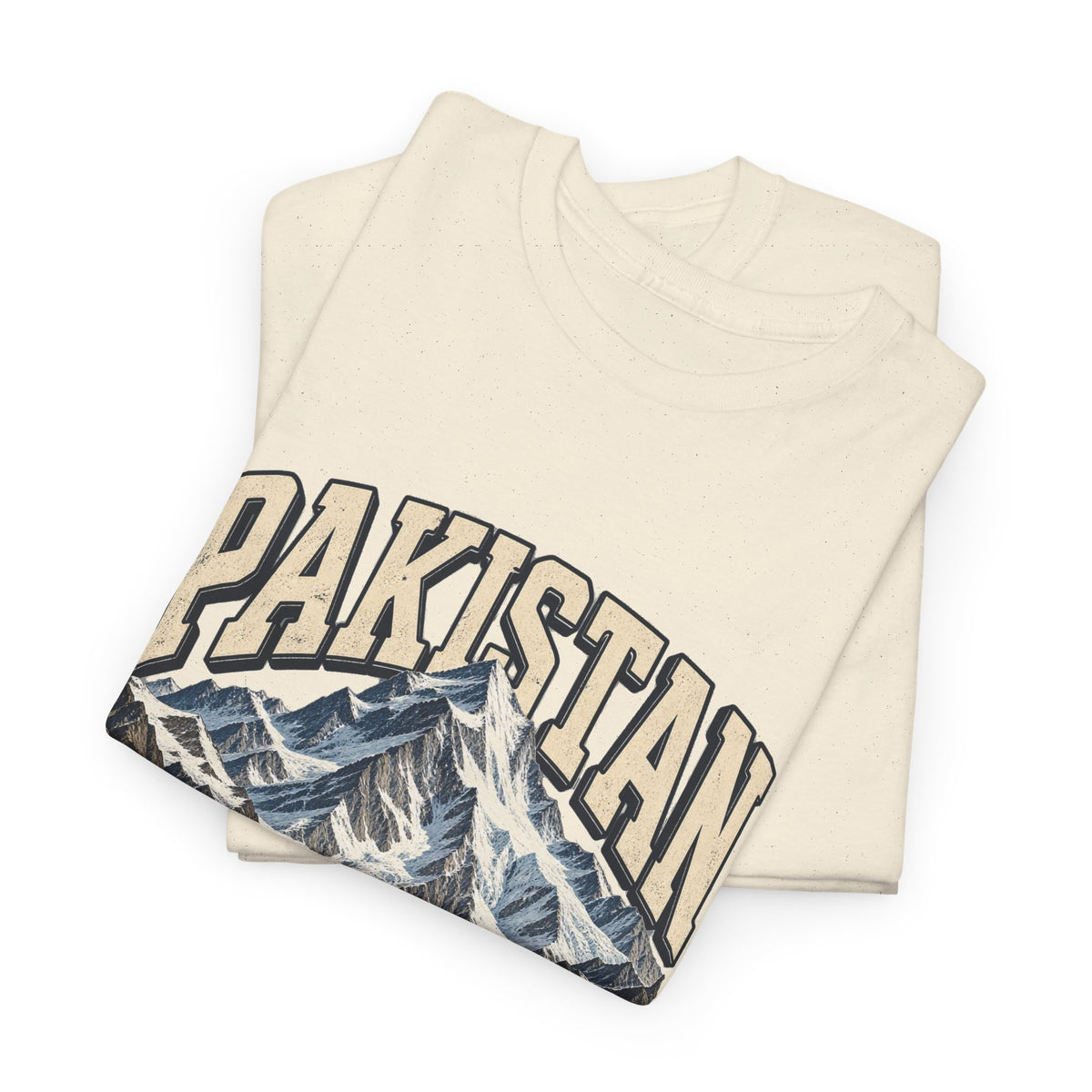 Folded Natural Pakistan Fresh Prints T-shirt showing outlined cream country lettering and snow-covered mountain peaks.