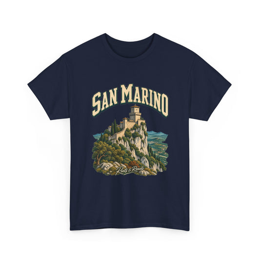 Front view of the navy Gildan 5000 San Marino Fresh Prints T-shirt, with cream SAN MARINO lettering, a stone fortress and mountain landscape, and Roots & Roads signature.
