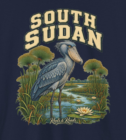Close-up of the South Sudan design with cream lettering, a shoebill, papyrus, water lilies and the Roots & Roads signature.