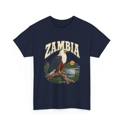 Front view of a Navy Gildan 5000 Zambia T-shirt with cream lettering, African fish eagle perched over a river, golden sun, grasses and Roots & Roads script.